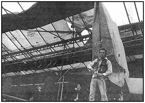 The scaffolder protests by dismantling the stage while the police look on and Lew Lewis halts his act - Photograph by Chalkie Davies
